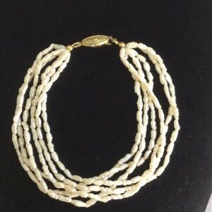Classic Multi-Strand Pearl Bracelet with Gold Color Clasp